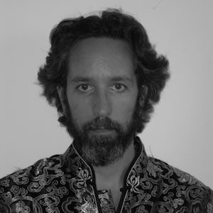 Guy Hoare 300 x 30 A man with wavy hair.