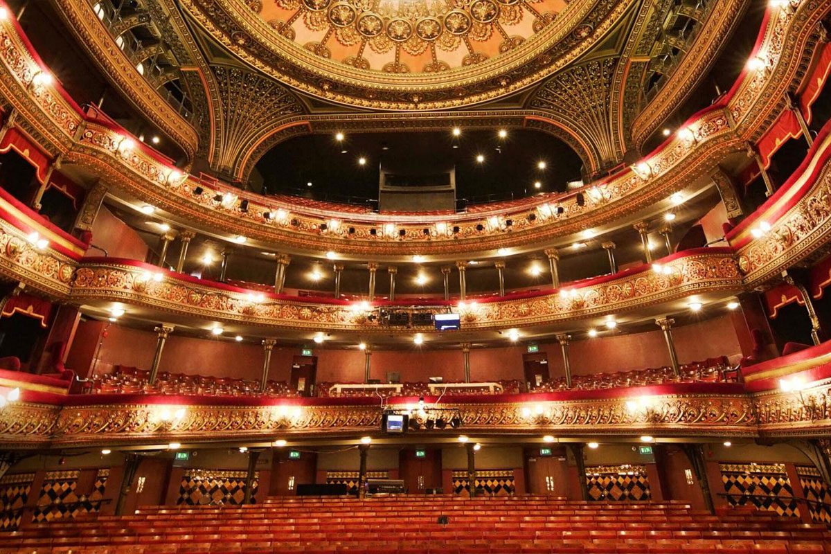 Panoramic view from the stage of the red, Victorian auditorium of Leeds Grand Theatre.