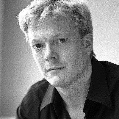 Black and white headshot of Toby Spence